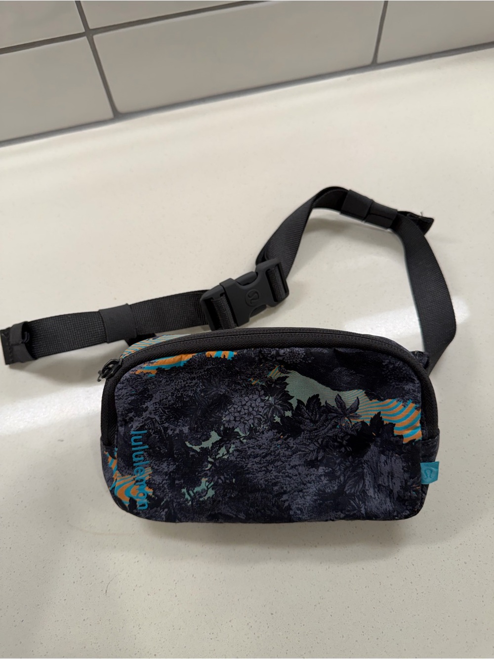 lululemon athletica Black Floral Mini Belt Bag with Teal and Orange Accents